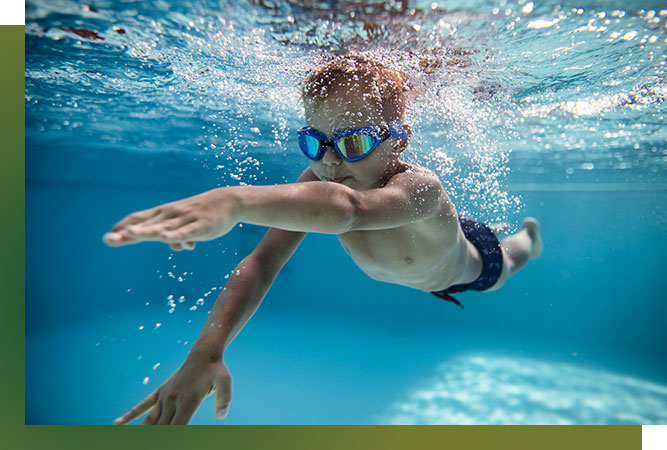 underwater image of kid swimming